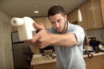 Cody Wilson shows the first completely 3D-printed handgun, the Liberator, at his home in Austin, Tex., on May 10