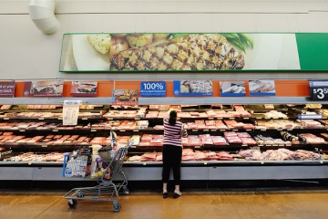 A customer buying meat at a Walmart Supercenter 